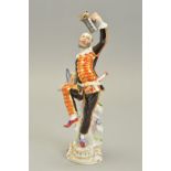 A 20TH CENTURY MEISSEN FIGURE OF A HARLEQUIN DANCING AND LAUGHING, holding a flagon aloft in his