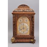 A LATE VICTORIAN CARVED OAK BRACKET CLOCK, arched brass 16cm (6 1/4'') dial with silvered chapter