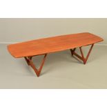 KURT OSTERVIG FOR JASON MOBLER, a Danish teak surfboard coffee table, on a pair of large sculpted