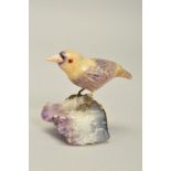CARVED FLUORITE BIRD, designed as a bird perched on a rough quartz base, fluorite bird with yellow