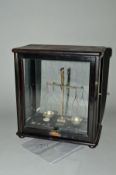 A LATE 19TH CENTURY CASED DIAMOND AND GEMSTONE BALANCE SCALE, fitted with ebonized or polished