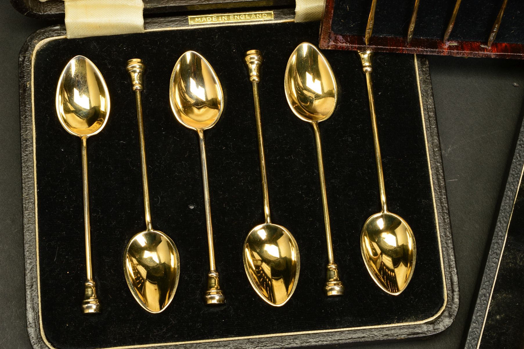 A CASED SET OF SIX ELIZABETH II SILVER GILT AND HARLEQUIN ENAMEL COFFEE SPOONS, circular seal end - Image 2 of 4