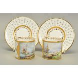 A PAIR OF STEFAN NOWACKI CABINET COFFEE CANS AND SAUCERS, cream ground enamelled and gilded with