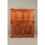 A VICTORIAN WALNUT AND MAHOGANY SIDEBOARD, moulded pediment above four panelled doors enclosing