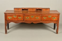 A MID 18TH CENTURY OAK DRESSER, the short raised back fitted with three short drawers and two pigeon