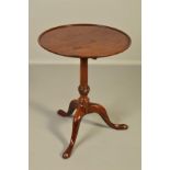 A GEORGE III MAHOGANY TRAY TOP TRIPOD TABLE, circular tilt top on a baluster column with cabriole