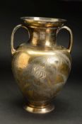 A VICTORIAN SILVER GILT TWIN HANDLED VASE, of baluster form and engraved with ferns, bearing a