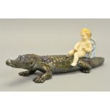 A RARE ROYAL DOULTON BOY ON A CROCODILE, known as HN373 but lacks factory mark and an HN number,