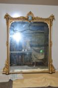 A MID 19TH CENTURY GILTWOOD OVERMANTEL MIRROR, of rectangular form, the pediment with swag and urn