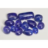 A SELECTION OF LARGE CABOCHON CUT TANZANITES, of various shapes, round, pear, oval, to include a