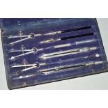 A VINTGE CASED GEOMETRY DRAUGHTSMAN DRAWING SET, to include compasses etc