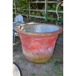 A LARGE RED PAINTED COMPOSITE URN, height 90cm x diameter 117cm (sd)