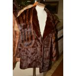 A LADIES FUR COAT SOLD BY FAULKES OF EDGBASTON, approximate size 14, together with a dark fur