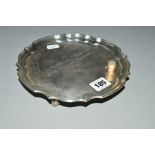 AN ELIZABETH II SILVER WAITER, pie crust rim, bears presentation inscription and commemorative