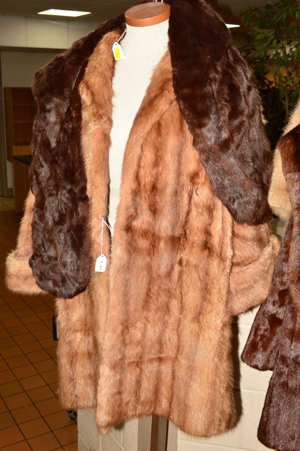 A LIGHT COLOURED LADIES FUR COAT, approximate size 14 together with a dark fur stole