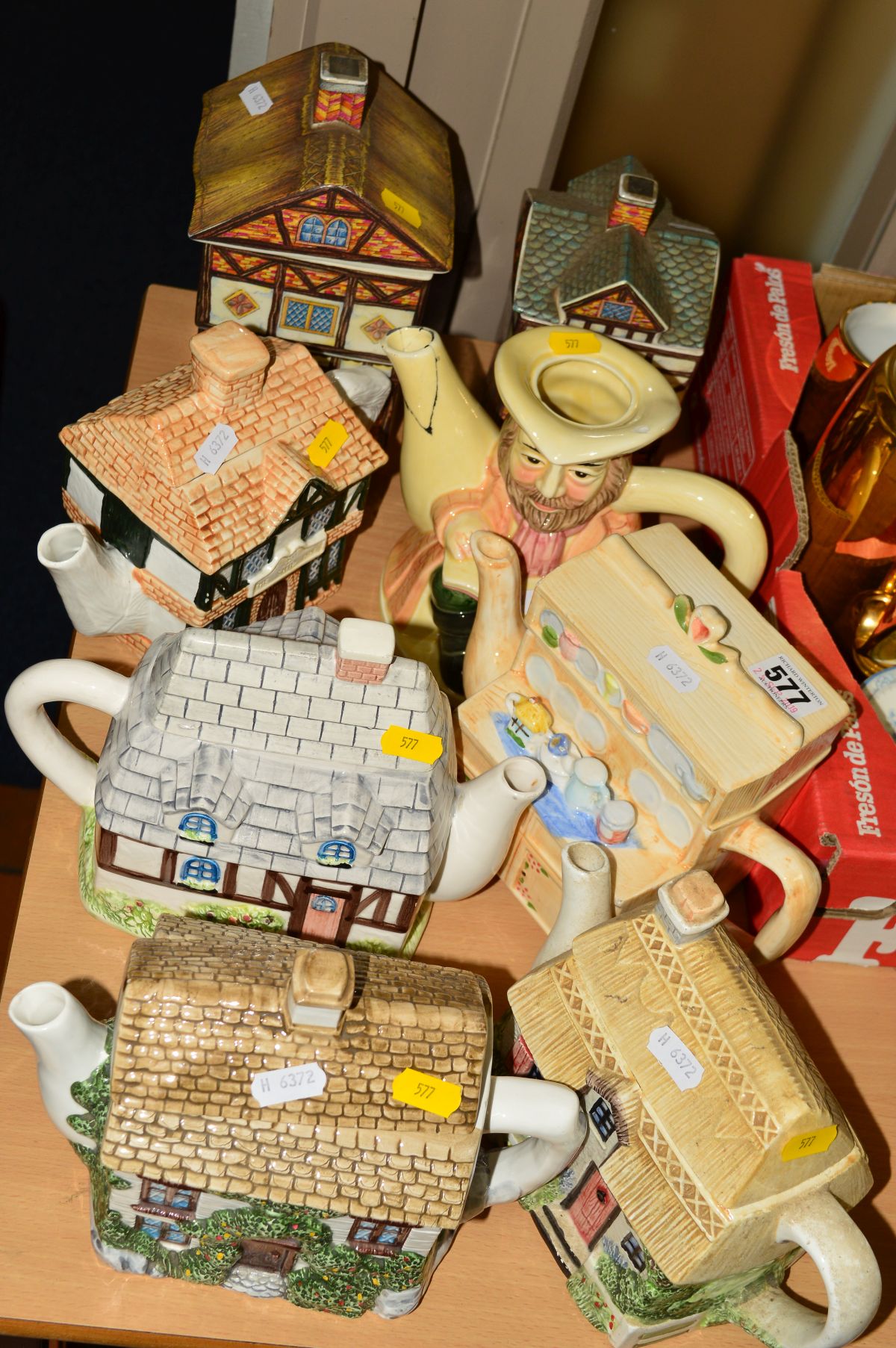 SIX NOVELTY TEAPOTS AND TWO SADLER STORAGE JARS, 'Country Village' (8)