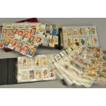 A COLLECTION OF ONE THOUSAND WILLS LTD CIGARETTE CARDS, in twenty one sets in two albums