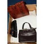 A BOX OF HANDBAGS AND LINEN to include snakeskin handbag, Radley dark brown handbag and a