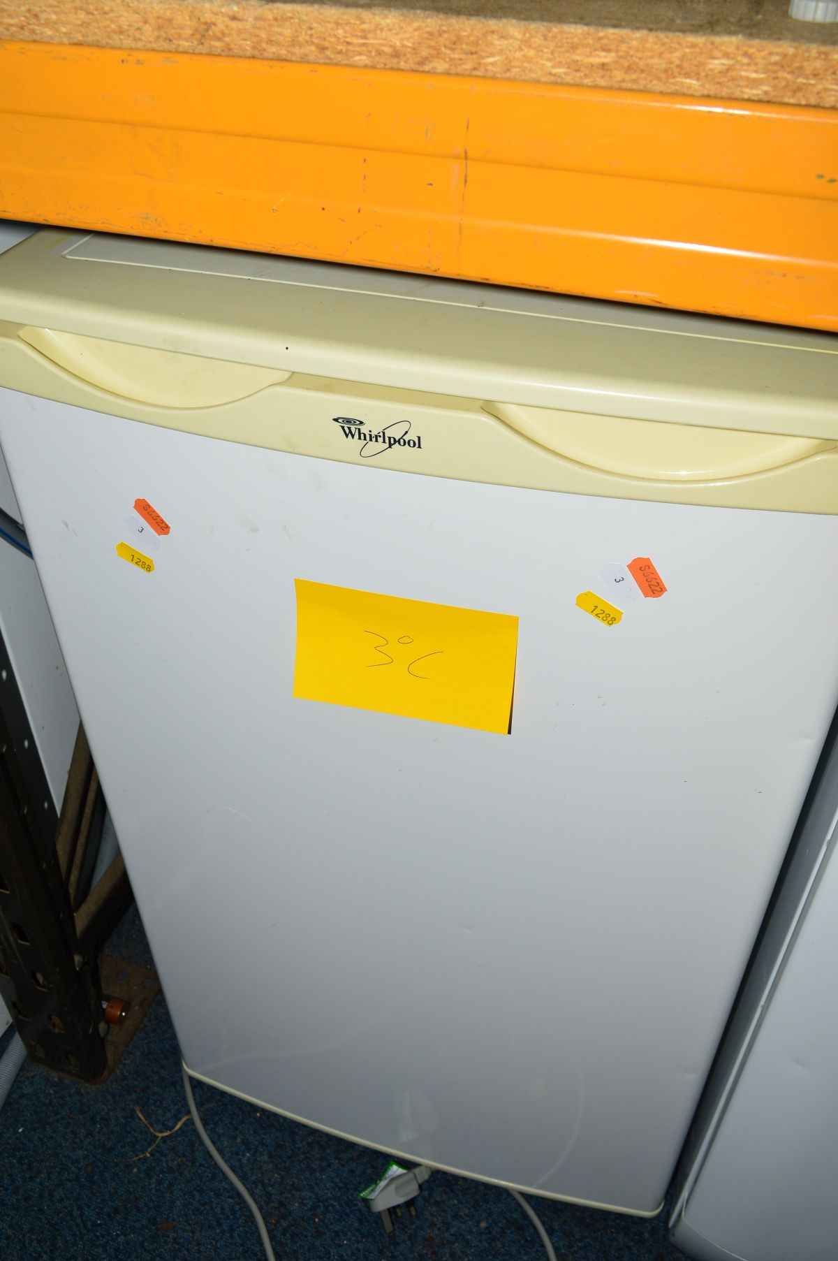 A WHIRLPOOL UNDER COUNTER FRIDGE and an Onyx undercounter freezer (2)