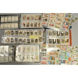 THREE CIGARETTE CARD ALBUMS, containing approximately one thousand five hundred cigarette cards, a