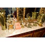 A COLLECTION OF BRASS to include a Smith lantern clock, candle sticks, urn, horse brasses, single