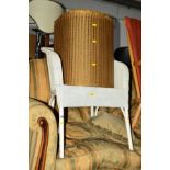 A GILT PAINTED LLOYD LOOM LINEN BASKET and a wicker bedroom chair (2)
