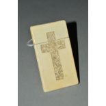 AN EARLY 20TH CENTURY IVORY CARD CASE, of rectangular outline, to one side carved with a cross of