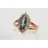 A 9CT GOLD GEM RING, designed as a central marquise shape gem assessed as a coated topazs, the