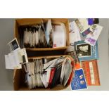 AN ACCUMULATION OF GREAT BRITISH FIRST DAY COVERS, and presentation packs and Mint sets (two boxes)