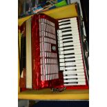 A CASED GALOTTA 120 BASS ACCORDIAN, red marble effect, forty one treble keys, s.d.