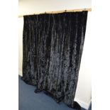 A PAIR OF BLACK VELVET CURTAINS, each curtain, width 172cm x drop 206cm