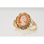 A 9CT GOLD CAMEO RING, designed as an oval cameo depicting a lady in profile in a collet setting