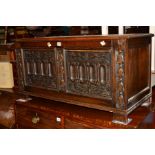AN EARLY 20TH CENTURY HEAVILY CARVED OAK BLANKET CHEST, width 99cm x depth 44cm x height 51cm