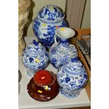 A PAIR OF EARLY 20TH CENTURY CHINESE PORCELAIN JARS AND COVERS, hand painted in blue and white,