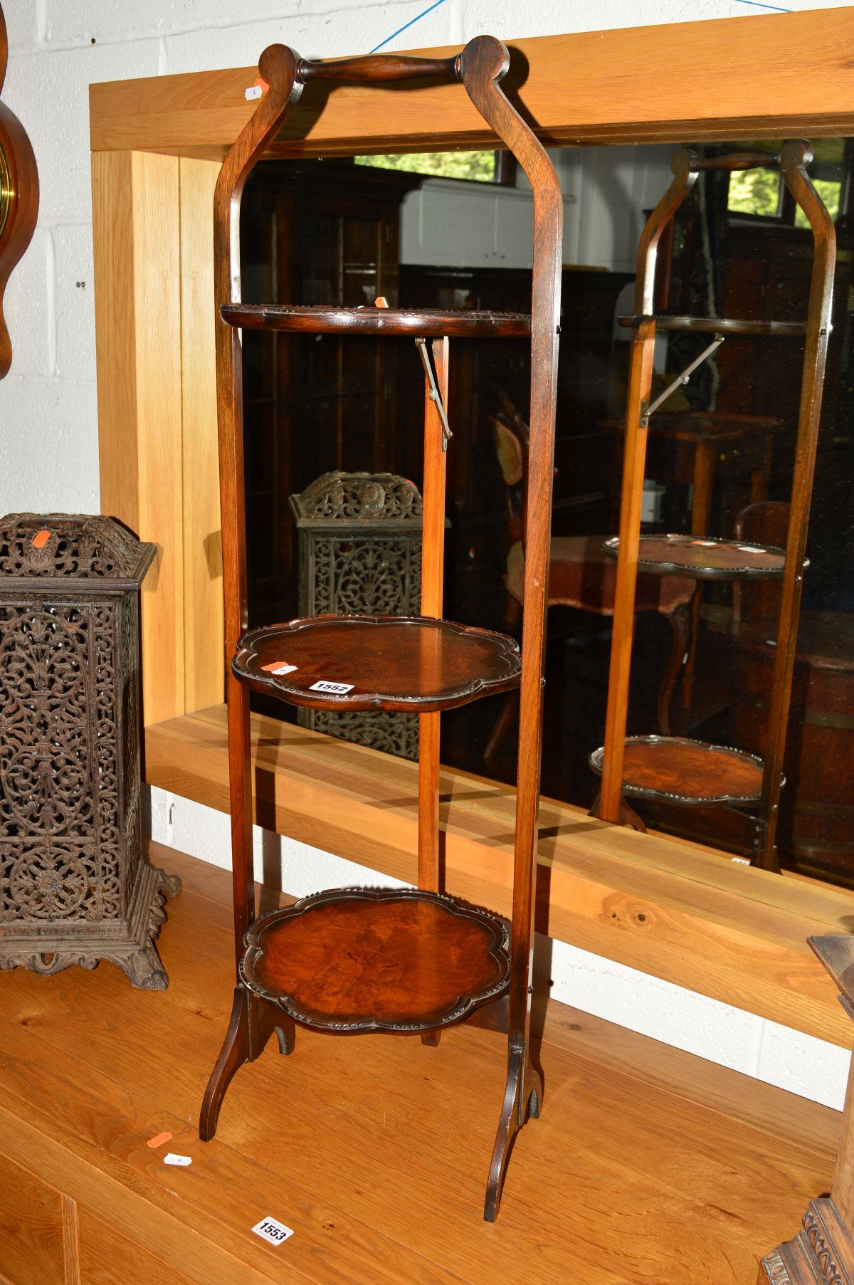 AN EDWARDIAN WALNUT AND OAK THREE TIER CAKE STAND