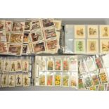 TWO CIGARETTE CARD ALBUMS, containing twenty sets of various manufacturers cigarette cards and a