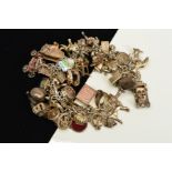 A CHARM BRACELET, the fancy link bracelet with spring ring clasp suspending forty eight charms, to