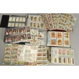 THREE CIGARETTE CARD ALBUMS, containing approximately two thousand three hundred and seventy Wills