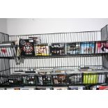 TWO WIRE FRAME DISPLAY SHELVES CONTAINING OVER THREE HUNDRED AND FIFTY CD'S AND DVD'S, of various