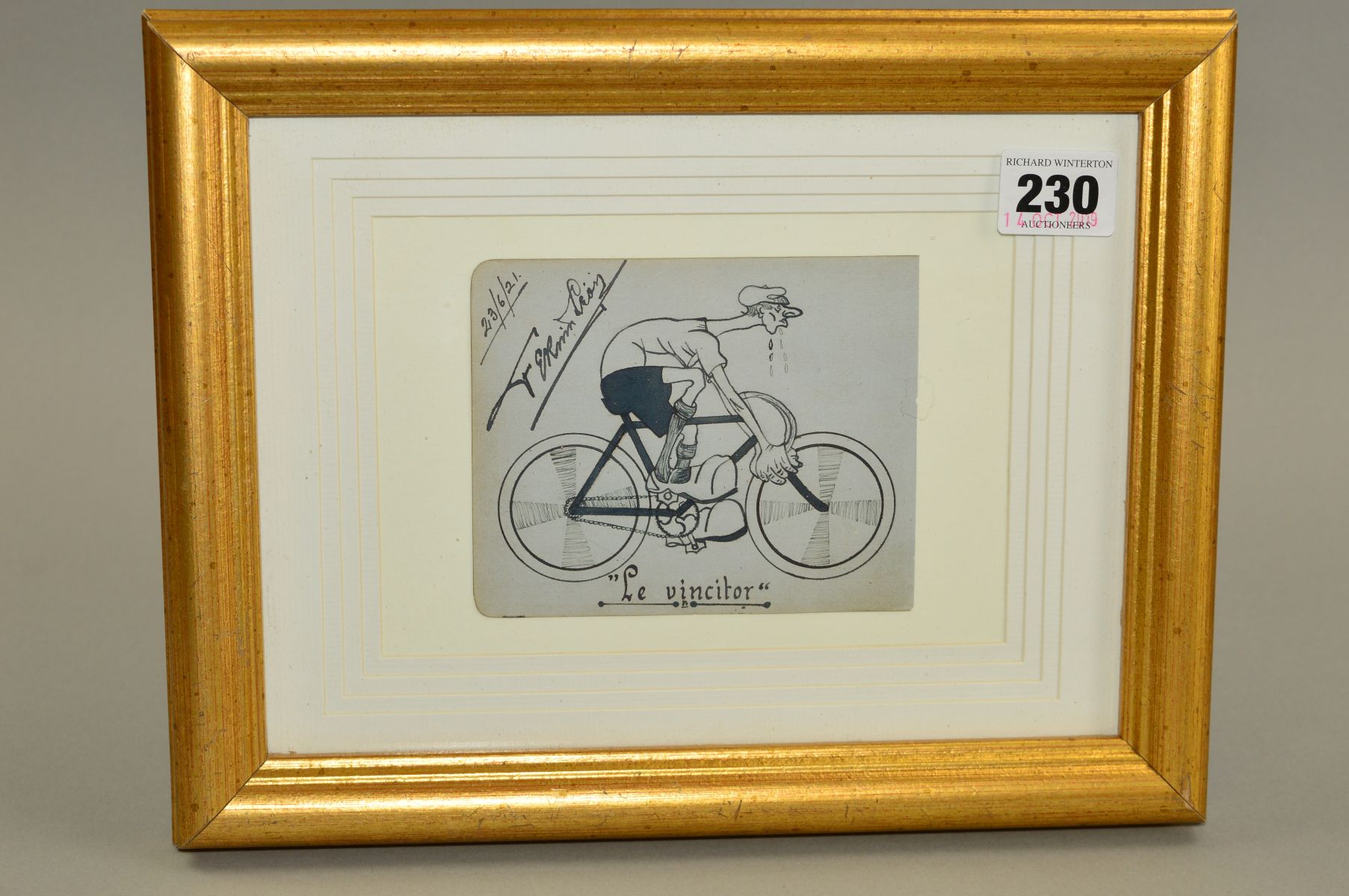 FRAMED AND SIGNED BLACK AND WHITE CARICATURE OF A CYCLIST, with the caption 'Le vincitor', dated