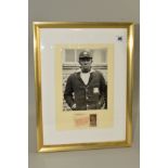 FRAMED, GLAZED AND AUTOGRAPHED PHOTOGRAPH OF SIR LEARY CONSTANTINE, (West Indies) wearing WI tour