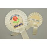 TWO ENGLAND ROSETTES, one small and one large with the words Twickenham and a cut out of a red