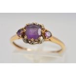 A 9CT GOLD AMETHYST AND DIAMOND RING, with a central square cut amethyst within a six claw setting