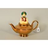 A WADE NOVELTY 'THE GENIE TEAPOT', modelled as the genie's head as the lid and Aladdin's lamp as the
