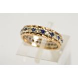 A MID TWENTIETH CENTURY SYNTHETIC BLUE AND WHITE SPINEL FULL ETERNITY BAND, ring size I 1/2,