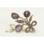AN AMETHYST AND MARCASITE BROOCH, of fkloral design, stamped silver, approximate weight 11 grams