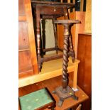 AN EARLY 20TH CENTURY CARVED OAK OCCASIONAL TABLE, oak barley twist torchere stand, small carved oak