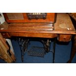 AN OAK SINGER TREADLE SEWING MACHINE