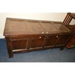 AN 18TH CENTURY OAK COFFER, four panels to hinged top and front, on stiles, some damage, width 150cm