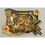 A TIN CONTAINING OVER FIFTY ITEMS OF MILITARY INTEREST, including cap badges, collar dogs, pin